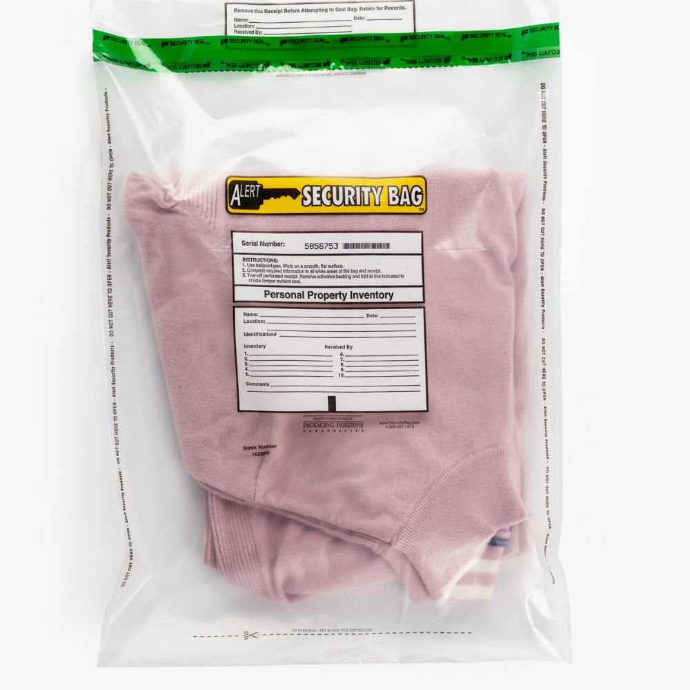The Personal Property Bag is used to store a pink t-shirt.